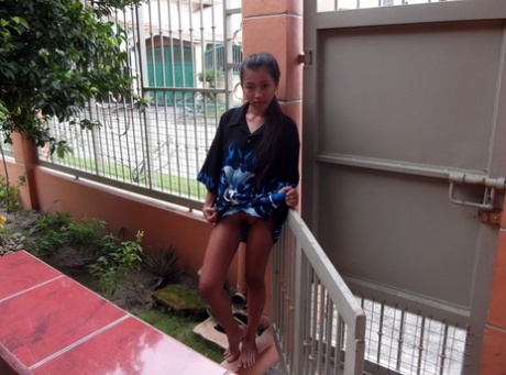Tiny Filipina girl Ashley poses her tight ass in the nude for a sex tourist