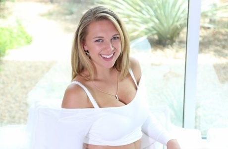 Blonde hottie in white Brooke Wylde shows her big juggs and pink pussy