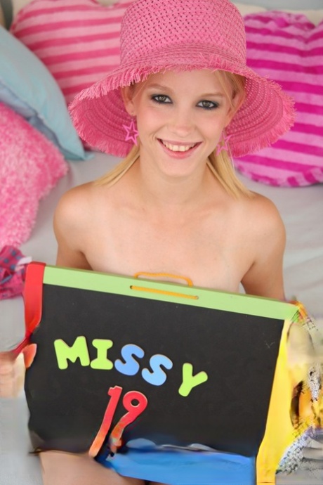 Petite 19 year old blonde Missy Mae shows her big natural tits and twat