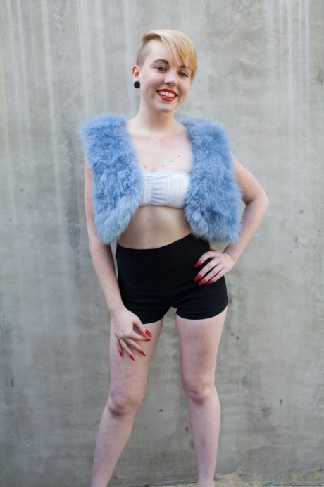 Short haired teen girl Miley May shows her naked body and pees in the street