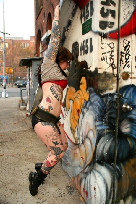 Chubby all natural Adahlia in daring outdoor strip showing off tattooed ass