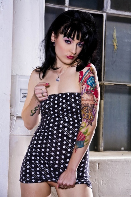 Alluring fetish model Draven doffs polka dot dress to pose nude in boots