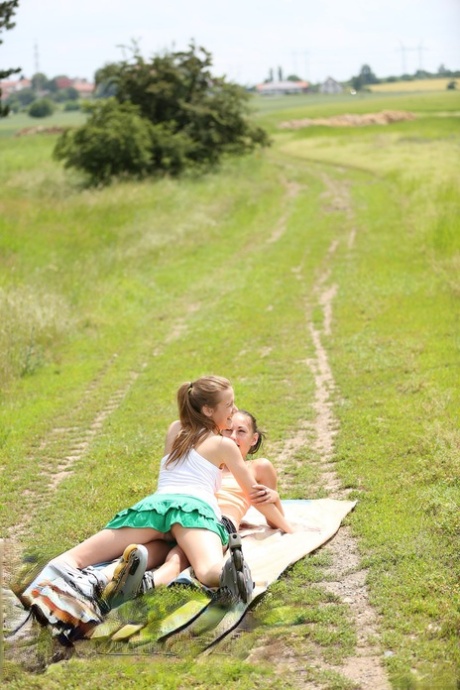 Lesbian dolls Alexis Crystal & El Storm play with toys & lick pussy in a field