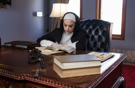 Horny nun Chanel Preston toys with a dildo then shoves it in Ana Foxxx's mouth