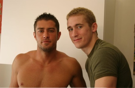 Blonde gay stud Mason Wyler giving his muscular partner a hot blowjob