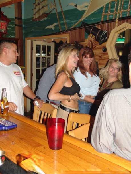 Naughty mature wife Tracy Lick shows off her big tits at a swingers party