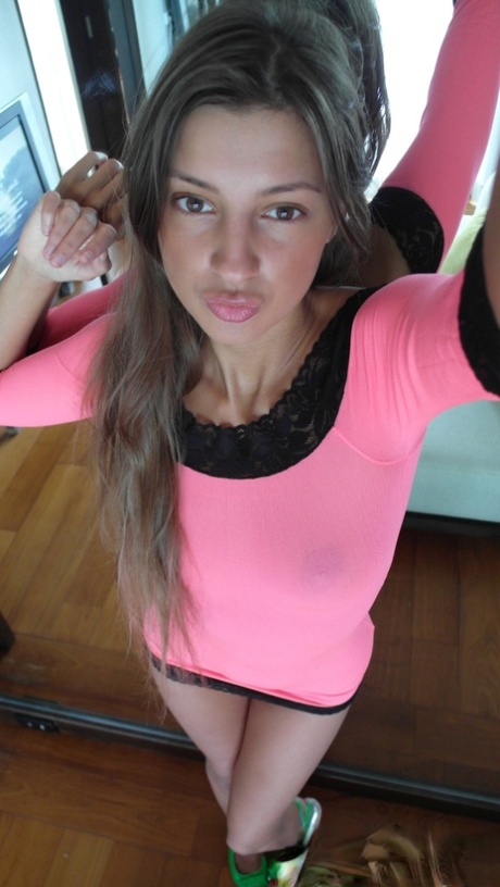 Russian beauty Malena Tara takes selfies as she strips and poses