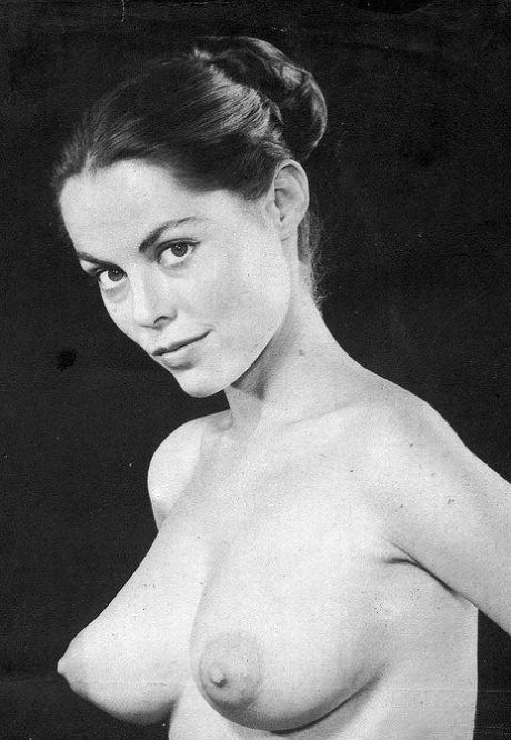 Vintage pornstar with nice big tits poses naked and in hot pantyhose
