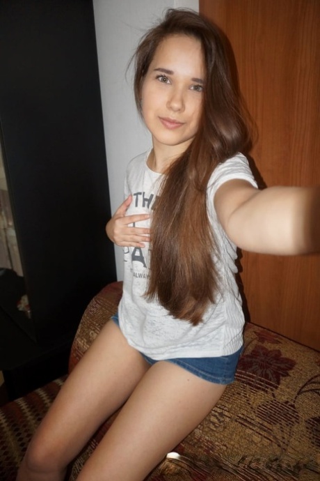 Beautiful amateur takes hot nude selfies while trying out her sexy outfits