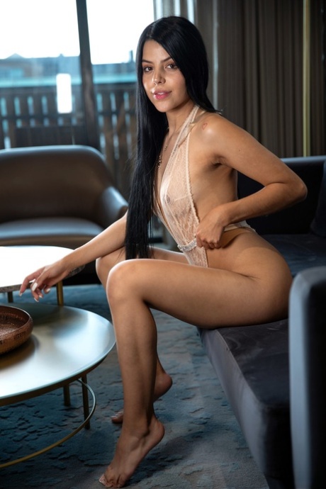 Latina teen babe Salome peels her lingerie off & poses on the sofa