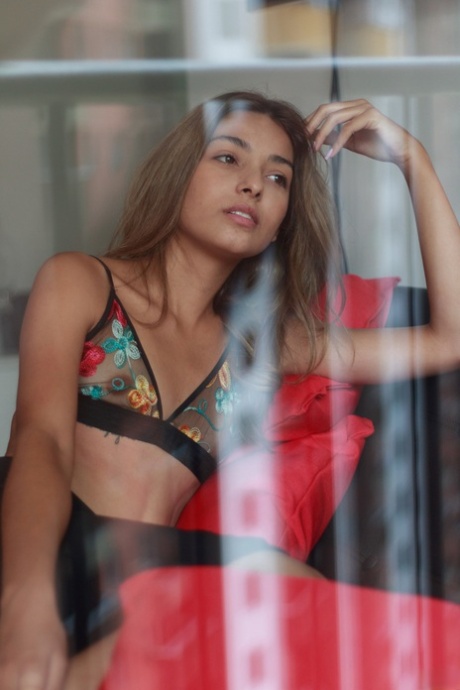 Sexy amateur babe Camilita Johanna shows her slim figure in a solo