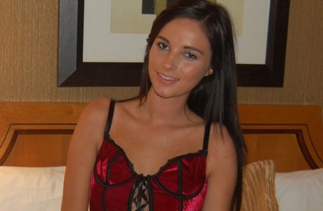 American beauty shows her petite tattooed body in lingerie in her hotel room