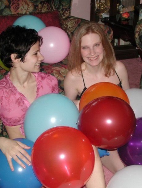 Amateur lesbians Addie, Roxanne strip & pose naked while playing with balloons