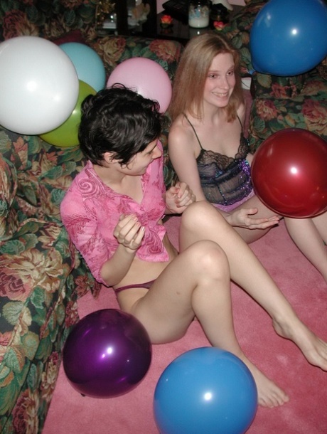 Amateur lesbians Addie, Roxanne strip & pose naked while playing with balloons