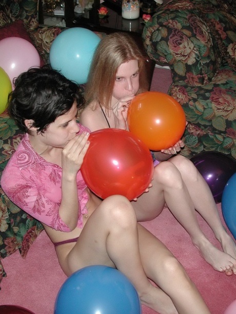 Amateur lesbians Addie, Roxanne strip & pose naked while playing with balloons