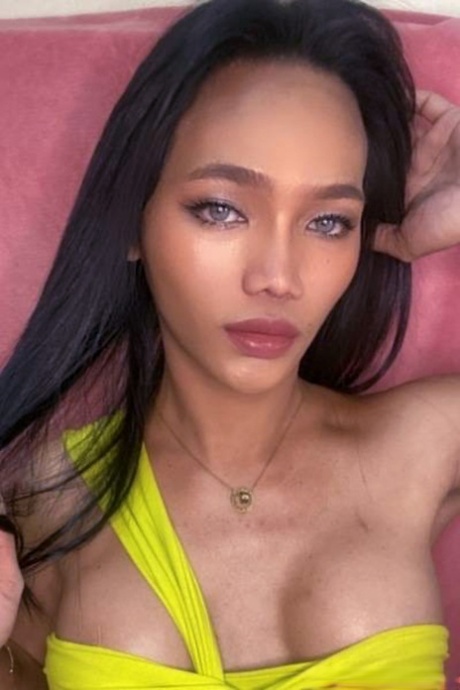 Beautiful Asian shemale posing in numerous hot outfits in her own compilation