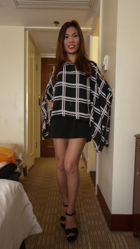 Slender Asian amateur Shane exposes her nice titties in a hotel room