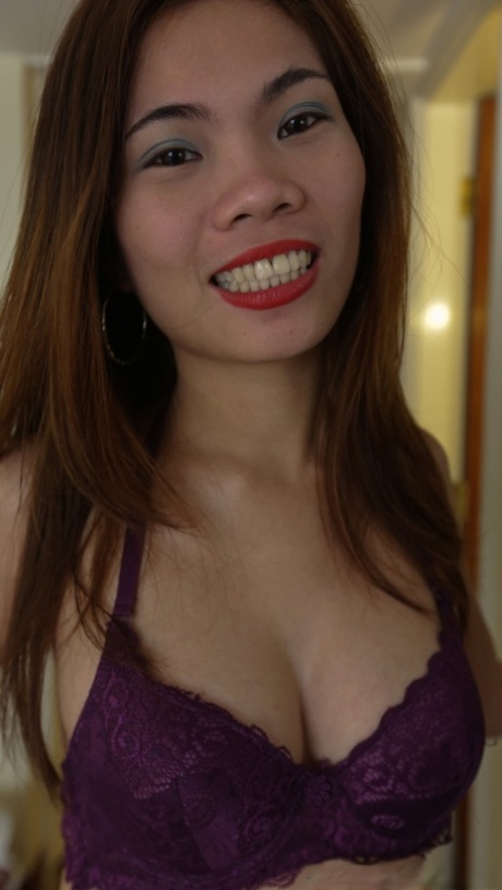 Slender Asian amateur Shane exposes her nice titties in a hotel room