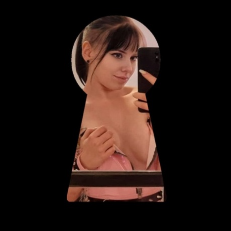 Sexy amateur Kira Jameson poses in her pink latex dress & heels in a solo