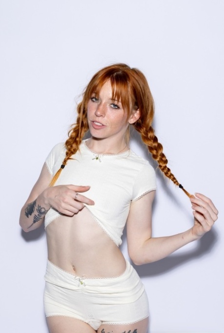Naughty ginger teen with pigtails Madi Collins strips & plays with a vibrator
