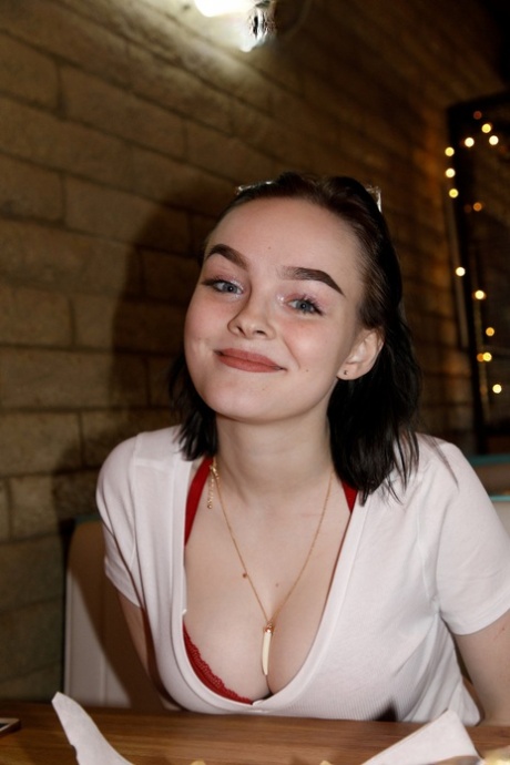 Brunette teen Vonnie Bean teases with her big juggs in a full tub
