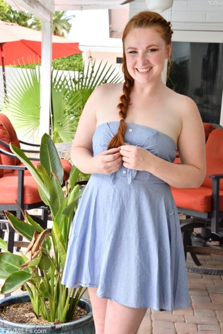 Ginger amateur Yaya shows off her nice tits and hairy pussy in a solo