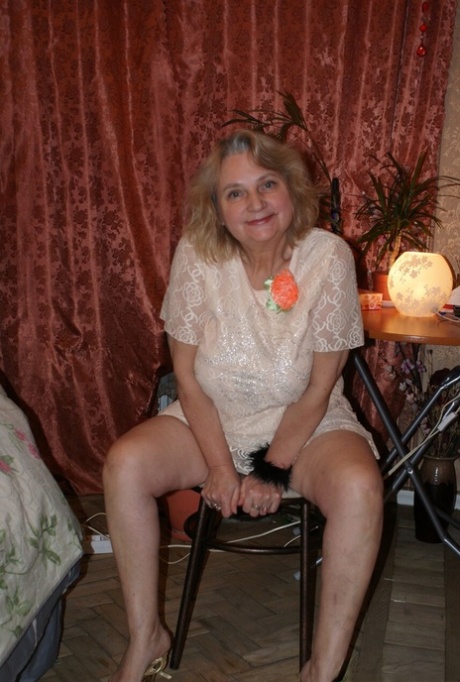 Amateur granny Helga strips naked & shows her huge saggy tits & hairy holes