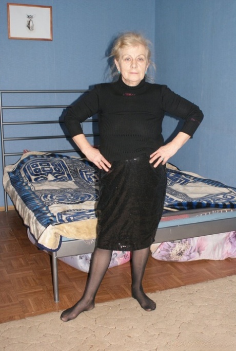 Gorgeous blonde granny Arina reveals her saggy tits and rubs her mature snatch