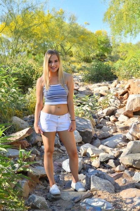 Beautiful teen Blake revealing her perfect pair of breasts in nature